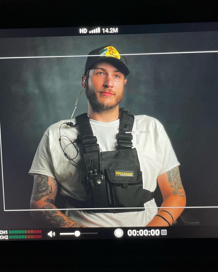 James Wolk on an interview set, seen on the camera monitor