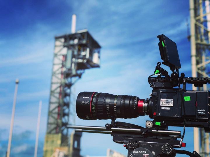 Cinema camera on the launch pad with the rocket tower behind