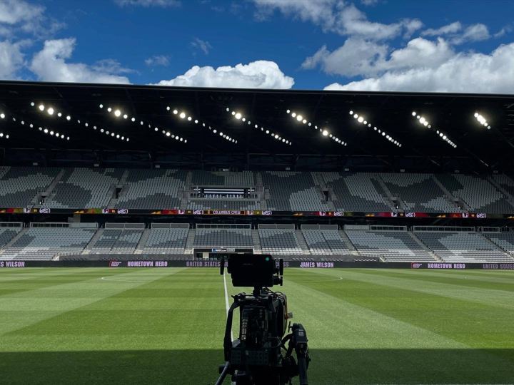Camera rig set up at pitch level in an empty MLS stadium