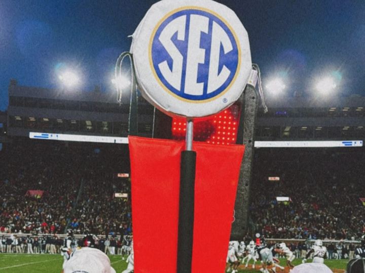 SEC logo pylon under stadium lights