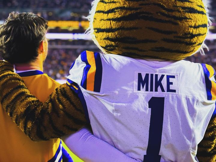 Mike the Tiger mascot with an LSU fan