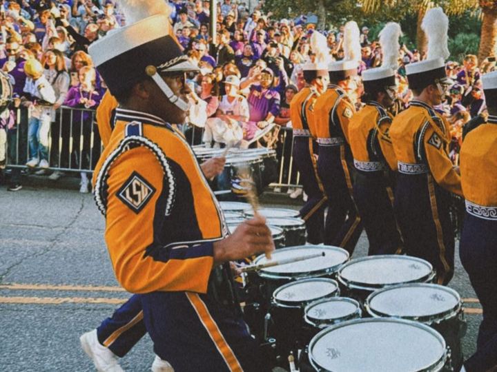Band drummer in gold and purple