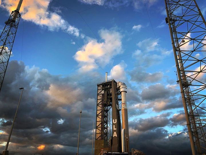 Launch tower under dramatic clouds