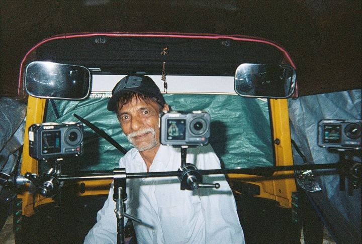 Driver in a car rigged with cameras