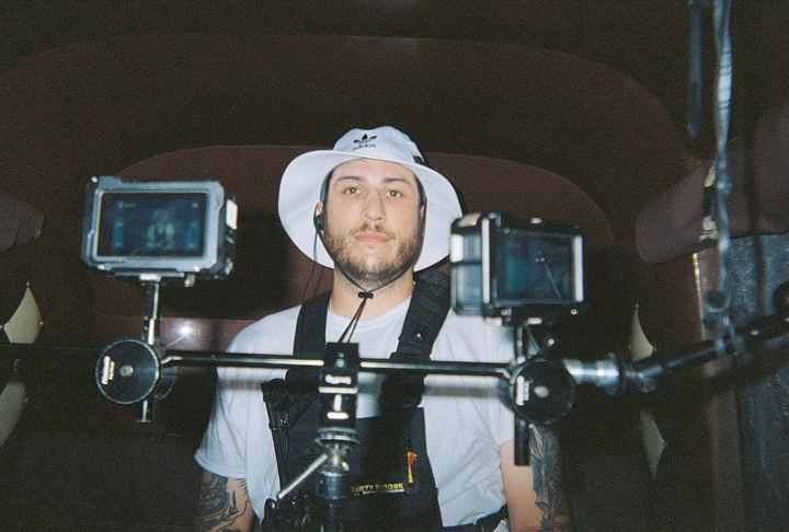 Passenger in a car rigged with cameras