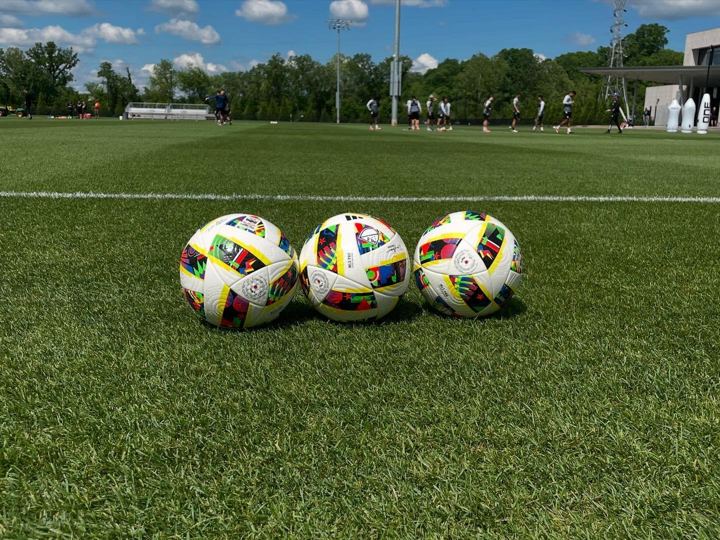 Three match balls on the pitch