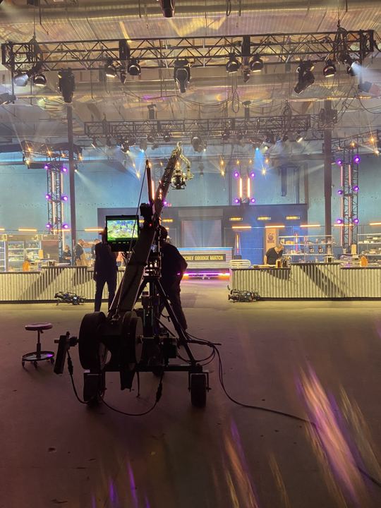 Camera crane on an arena stage set