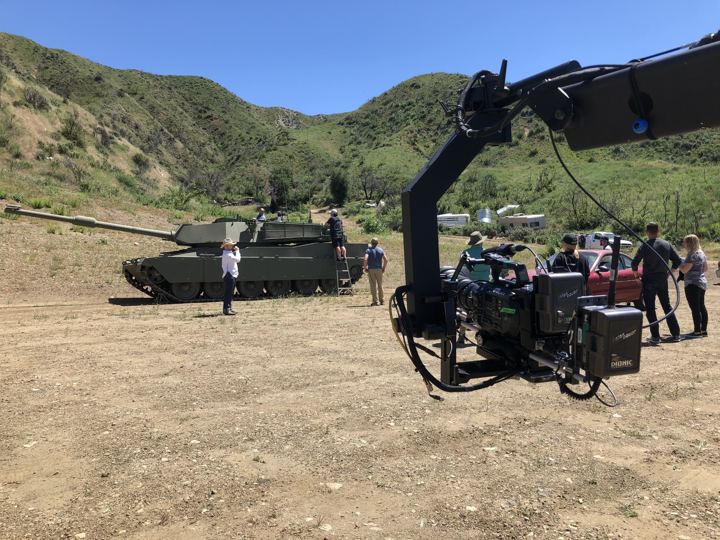 Crane rig set up beside a tank on location